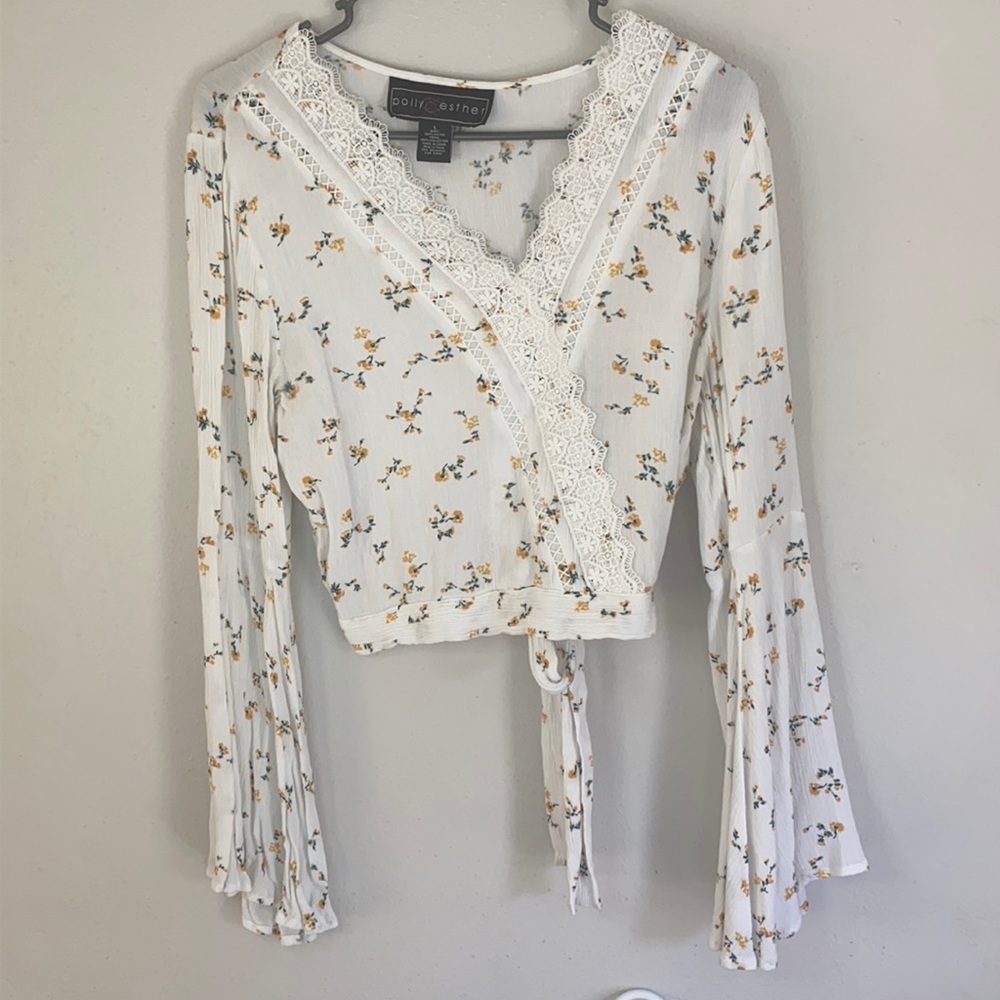 Beautiful white blouse with tons of detail.